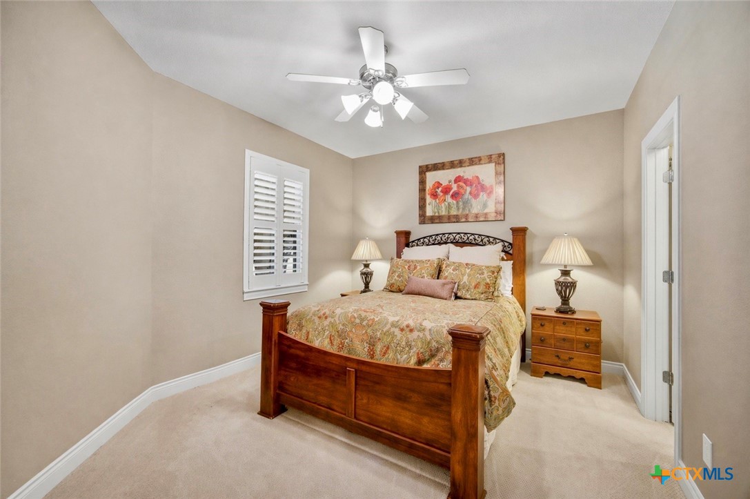 2427 Anderson Point Lane Spring, TX 77388 - Photo 33 of 47 a bedroom with a bed and a chandelier