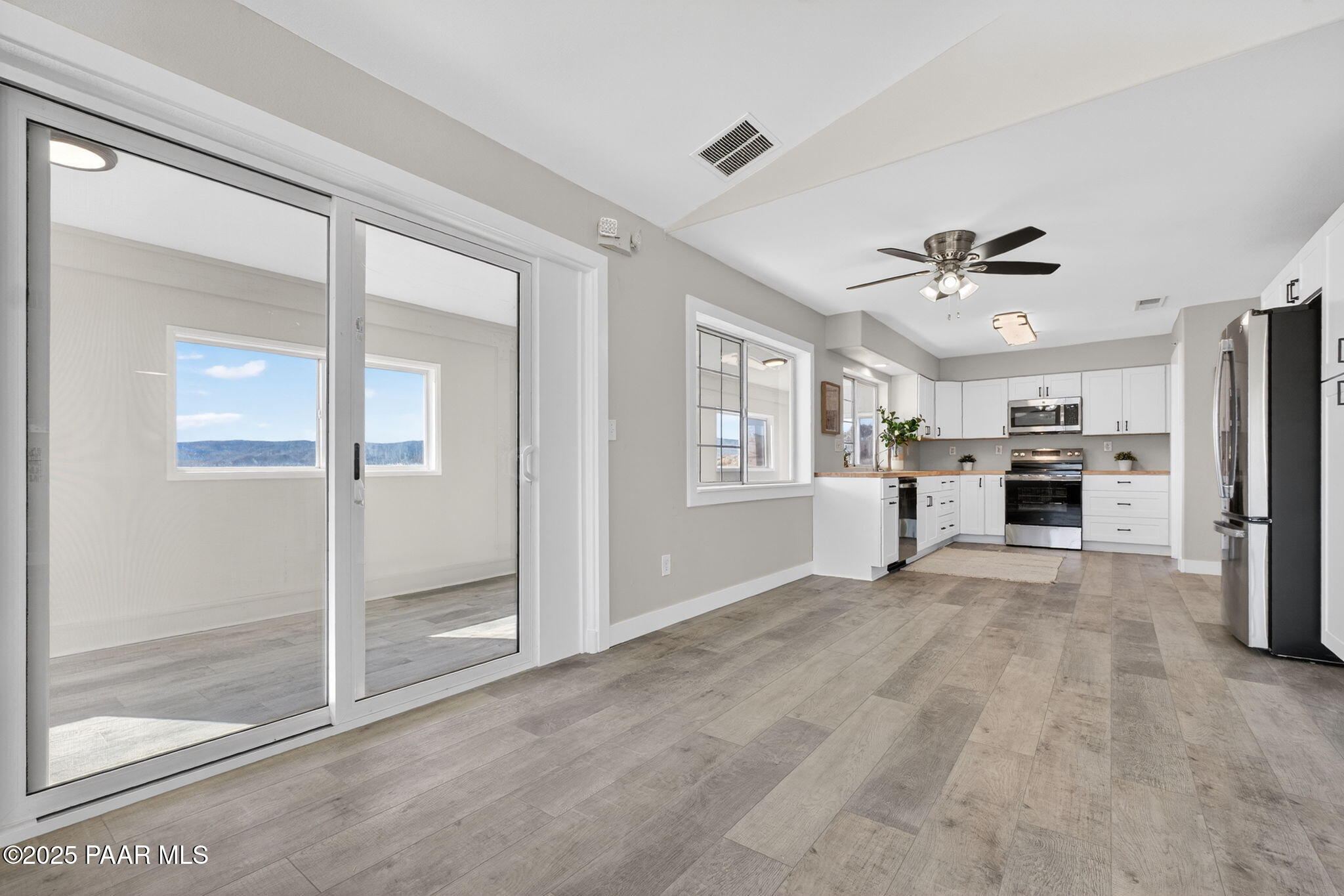 14410 East Blue Ridge Road Dewey-Humboldt, AZ 86327 - Photo 13 of 60 a view of a kitchen with a sink and a refrigerator