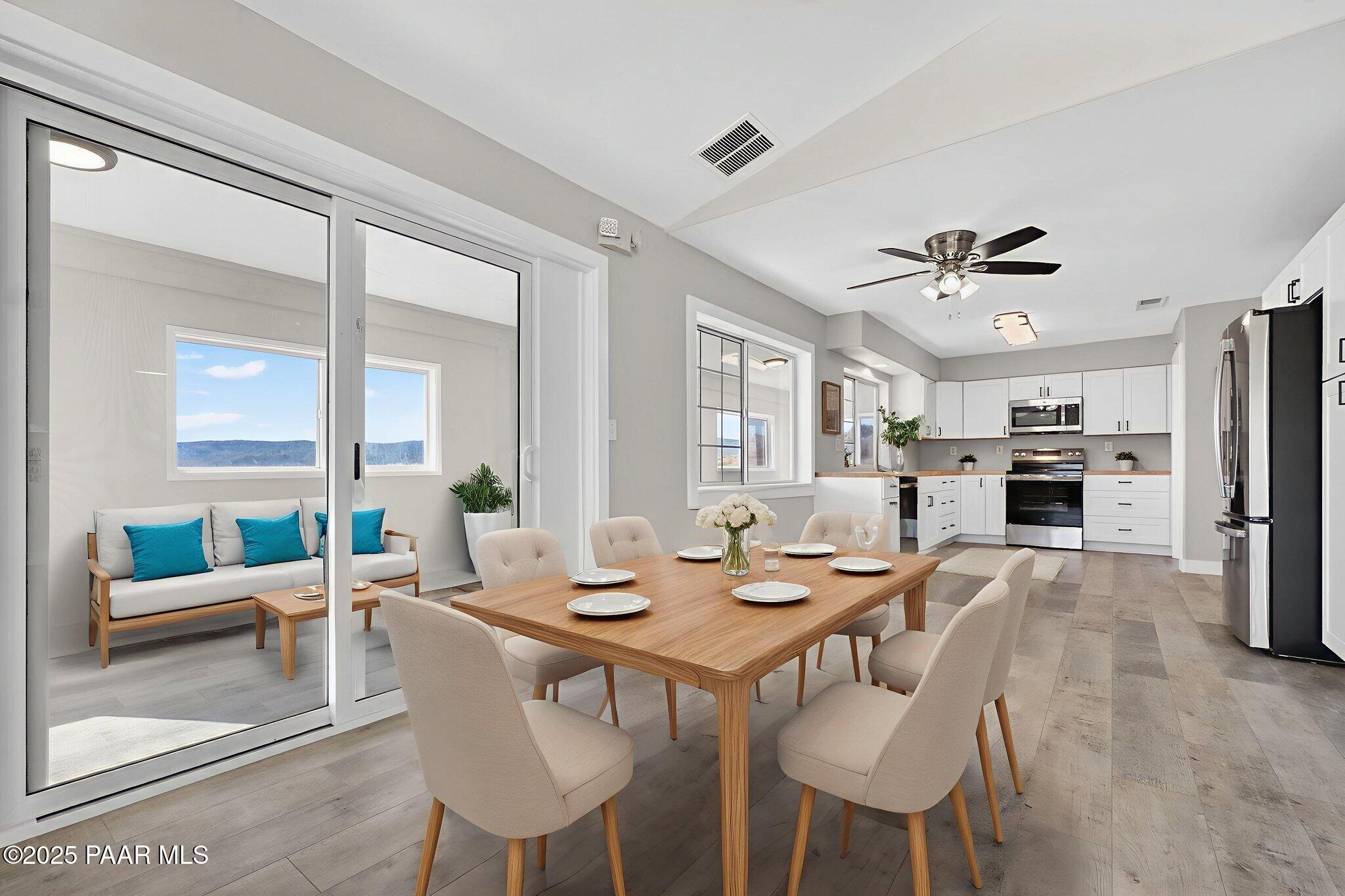 14410 East Blue Ridge Road Dewey-Humboldt, AZ 86327 - Photo 14 of 60 a view of a dining room with furniture
