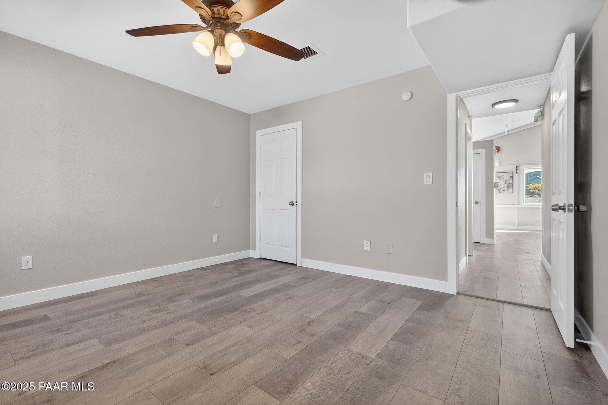 14410 East Blue Ridge Road Dewey-Humboldt, AZ 86327 - Photo 24 of 60 an empty room with fan and entrance