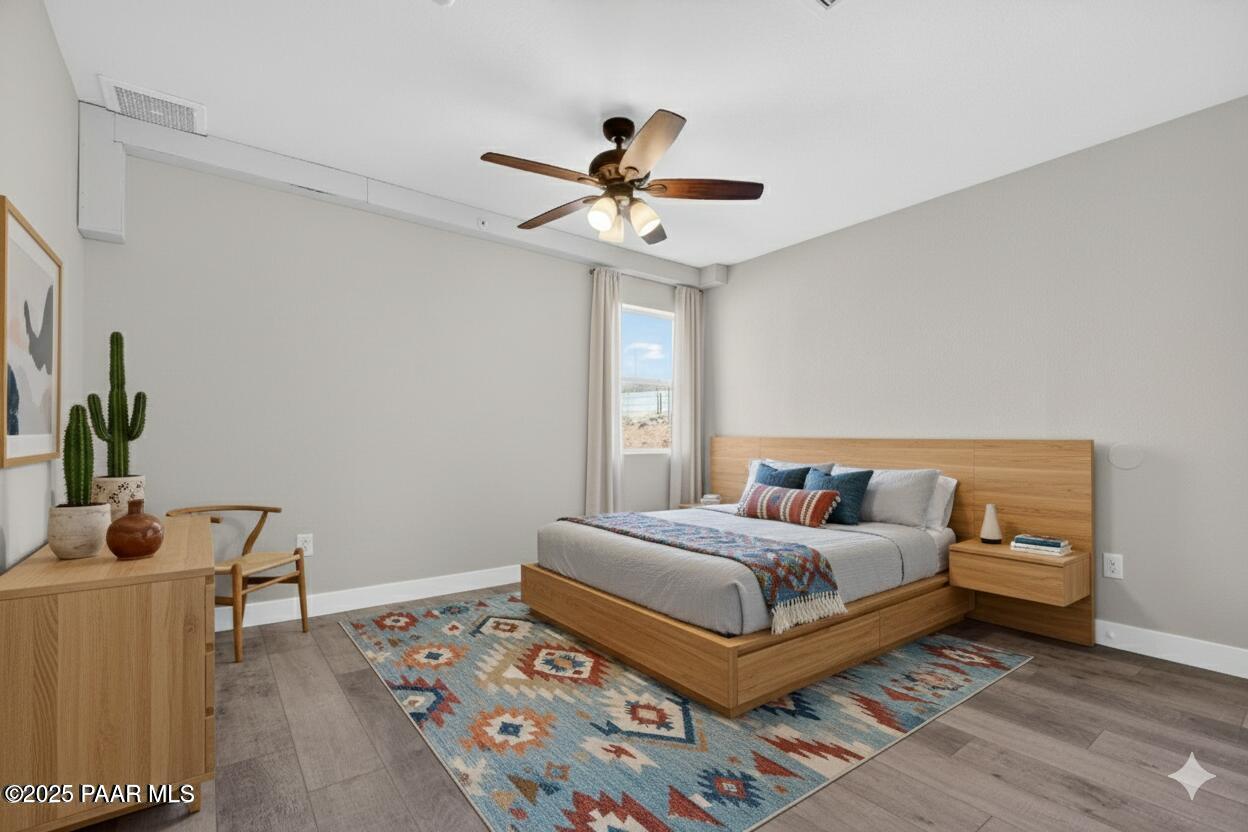 14410 East Blue Ridge Road Dewey-Humboldt, AZ 86327 - Photo 27 of 60 a bedroom with a bed and a window