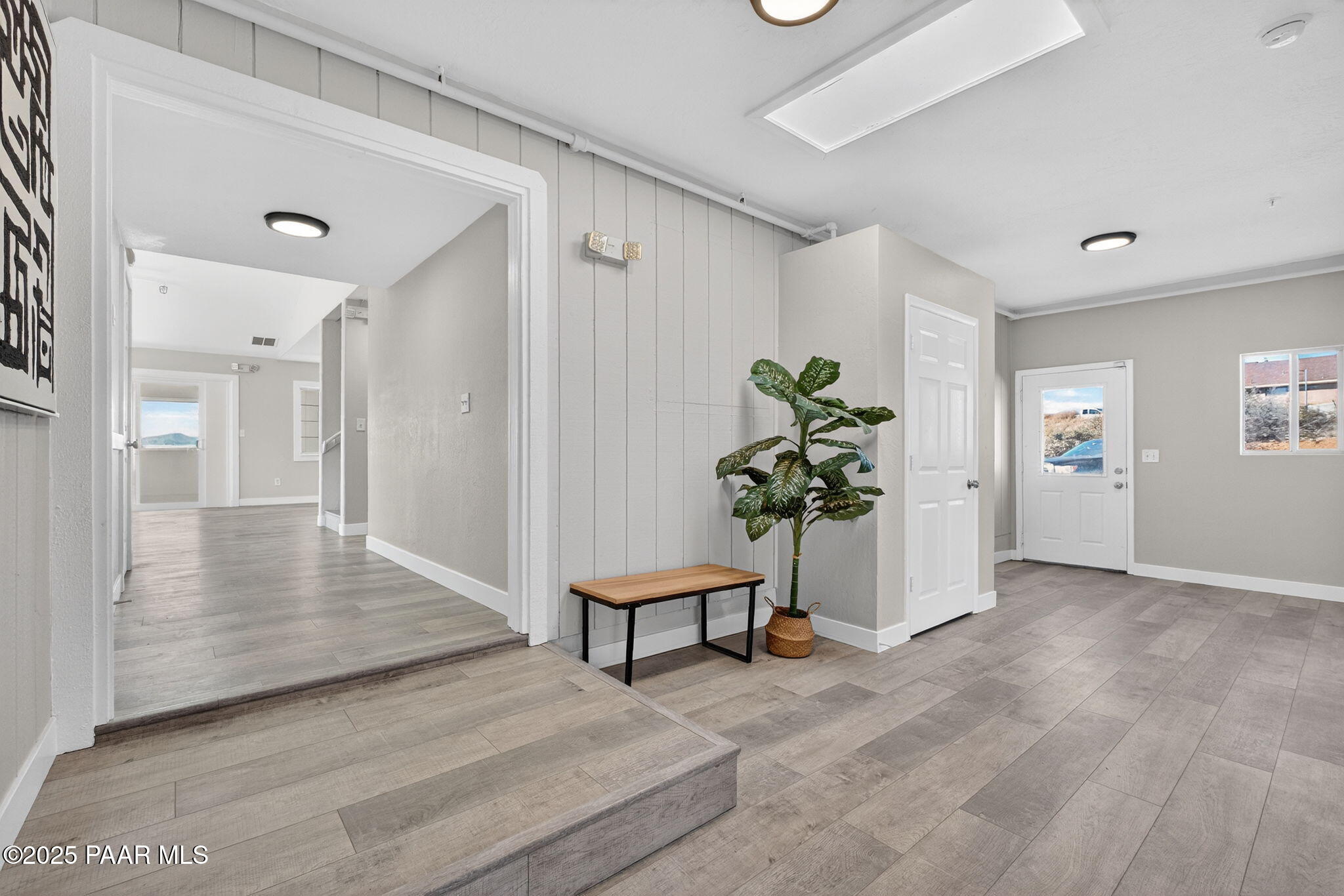 14410 East Blue Ridge Road Dewey-Humboldt, AZ 86327 - Photo 4 of 60 view of a hallway with wooden floor and a potted plant
