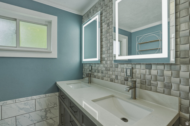 500 North 800 East Springville, UT 84663 - Photo 19 of 51 Full bathroom with double vanity, marble finish flooring, crown molding, and a textured wall
