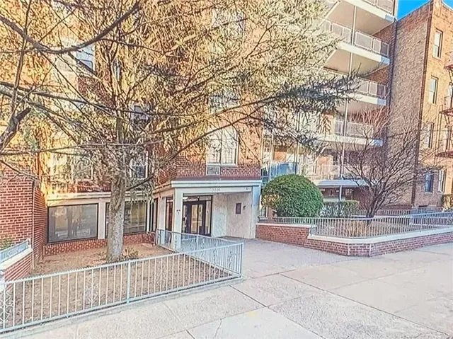 front view of a house with a small yard