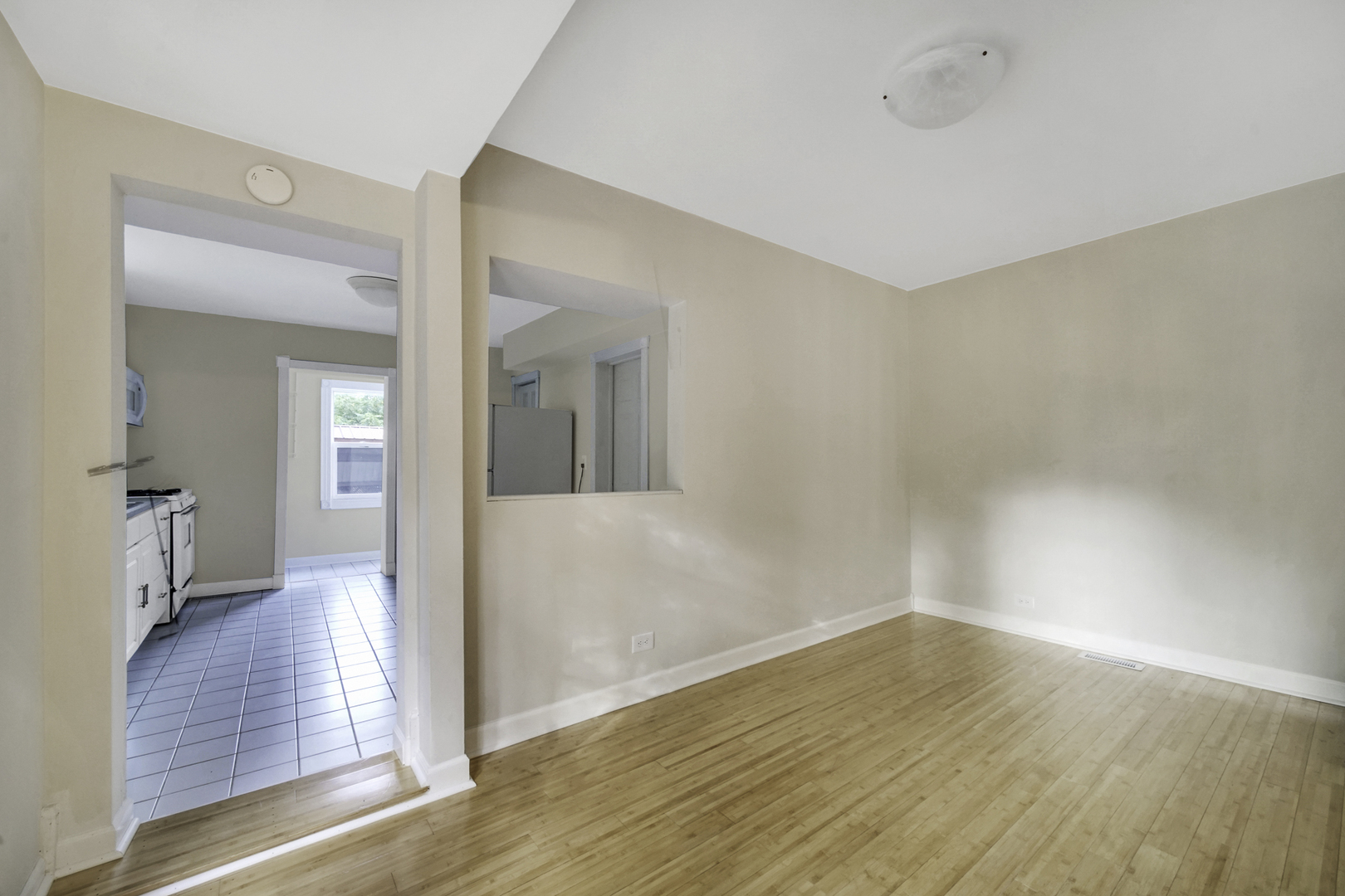 2136 Chestnut Road Homewood, IL 60430 - Photo 8 of 26 a view of a hallway with wooden floor and a bathroom