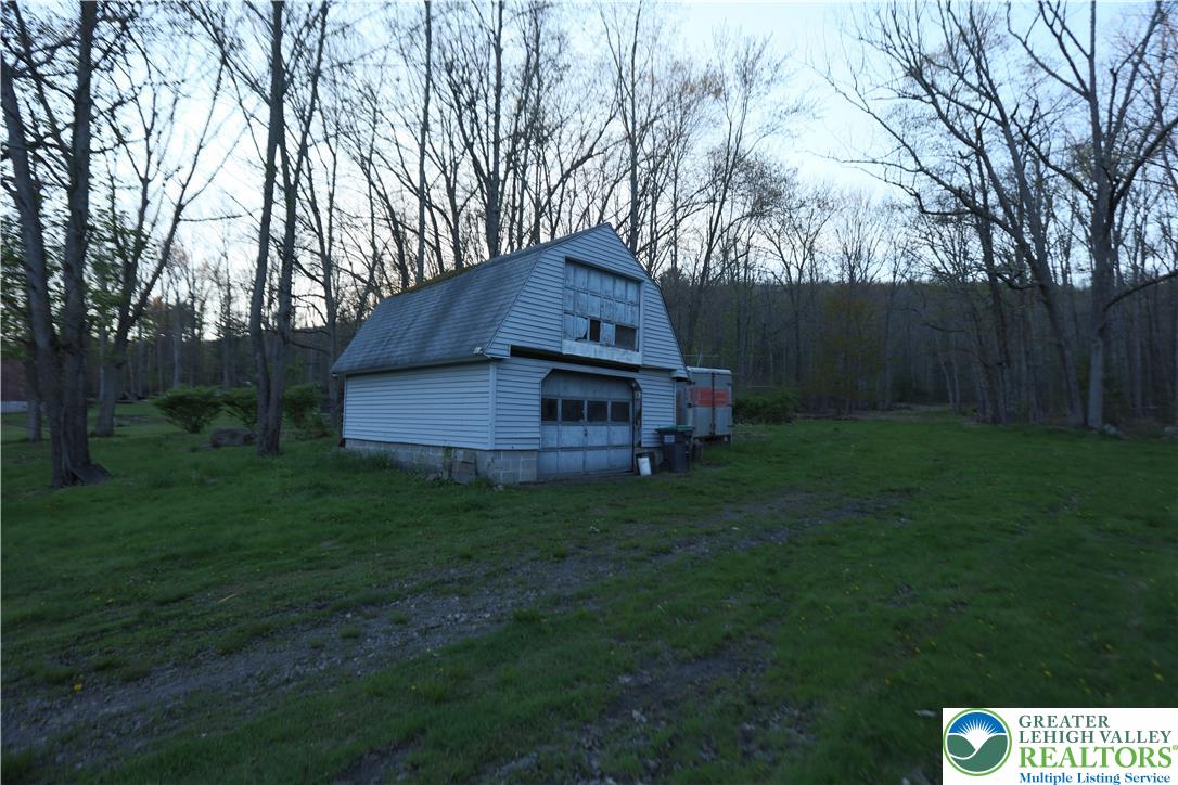 5444 Quakake Road Weatherly, PA 18255 - Photo 10 of 21 A charming barn with a gambrel roof awaits transformation on this verdant lot.