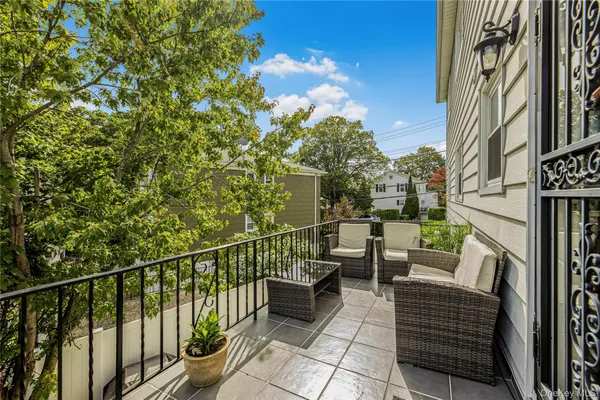 a view of a balcony with chairs