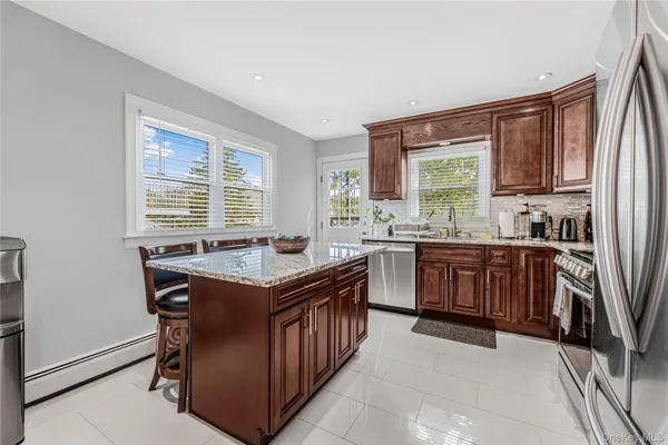 a kitchen with a stove top oven sink and cabinets