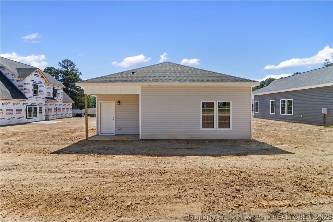 802 Holmes Street Clinton, NC 28328 - Photo 20 of 31 a front view of a house with a yard