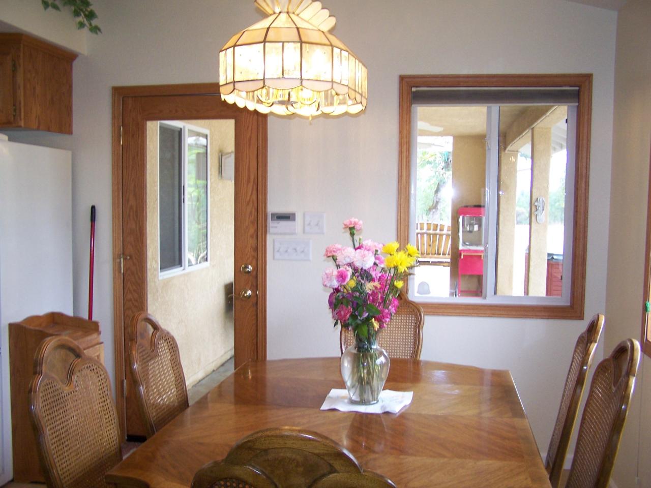 12800 Intermountain Road Redding, CA 96003 - Photo 19 of 39 a view of a dining room with furniture and a chandelier