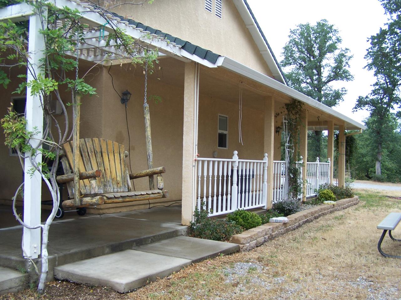 12800 Intermountain Road Redding, CA 96003 - Photo 6 of 39 a view of a house with a porch next to a patio