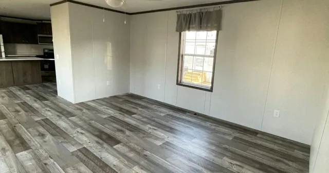 a view of an empty room with a window