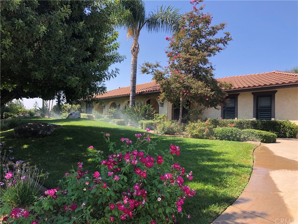 16435 Everetts Way Riverside, CA 92504 - Photo 1 of 1 a view of a house with a big yard and fountain