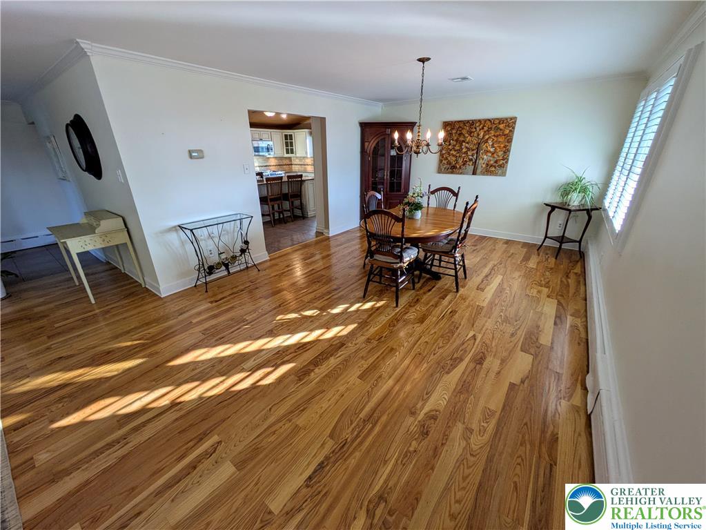 3285 Cherryville Road Northampton, PA 18067 - Photo 14 of 51 Gleaming ash hardwood floors and classic crown molding define this open dining room space.