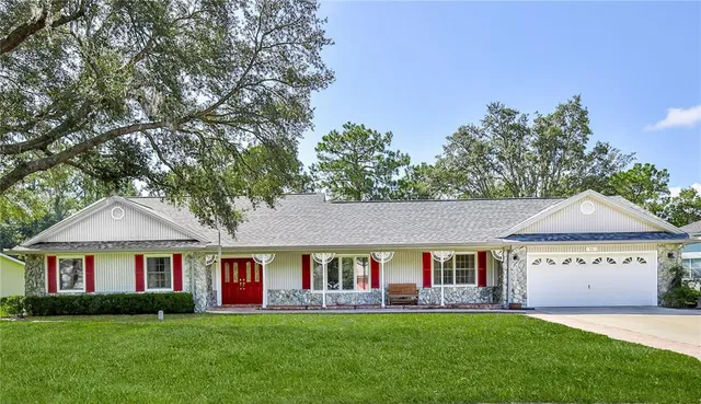 a front view of a house with a yard and porch