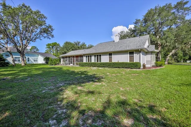 a view of a kitchen with granite countertop cabinets and stainless steel appliances
