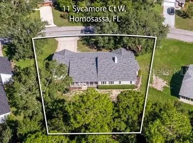 a large kitchen with granite countertop a stove a sink and dishwasher wooden cabinets with granite countertops