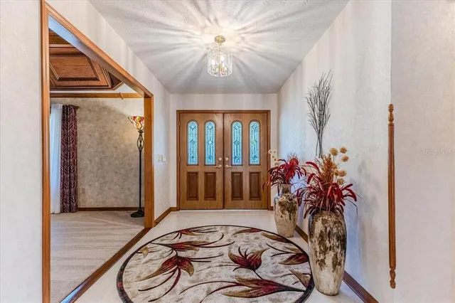a kitchen with stainless steel appliances granite countertop a stove cabinets and a refrigerator