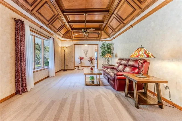 a large kitchen with stainless steel appliances kitchen island granite countertop a refrigerator and a sink