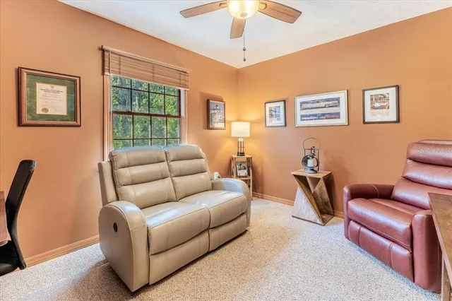 an aerial view of a house with swimming pool patio and lake view