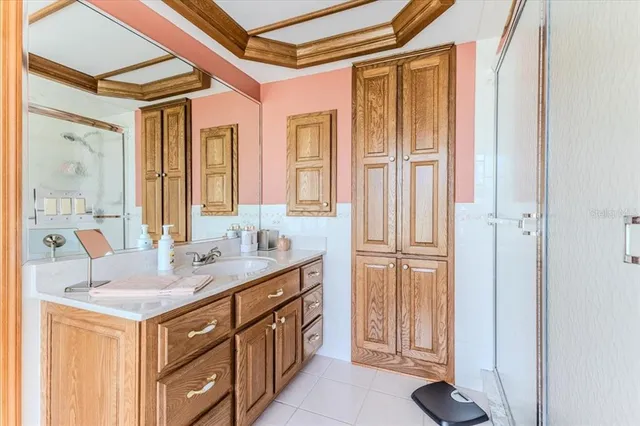 an aerial view of residential houses with outdoor space and trees all around