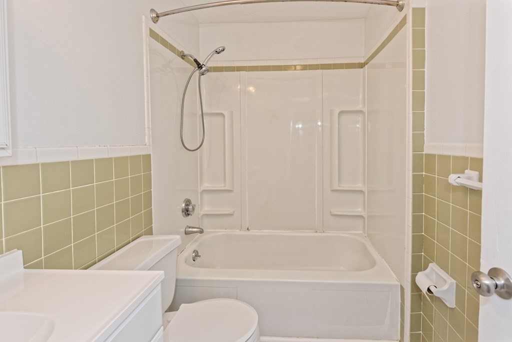 176 Maple Avenue, Unit 27 Rutland, MA 01543 - Photo 11 of 19 a bathroom with a bath tub a toilet and a shower