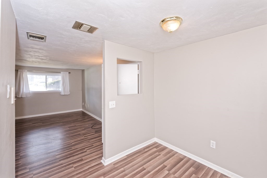 176 Maple Avenue, Unit 27 Rutland, MA 01543 - Photo 14 of 19 a view of a room with wooden floor and window