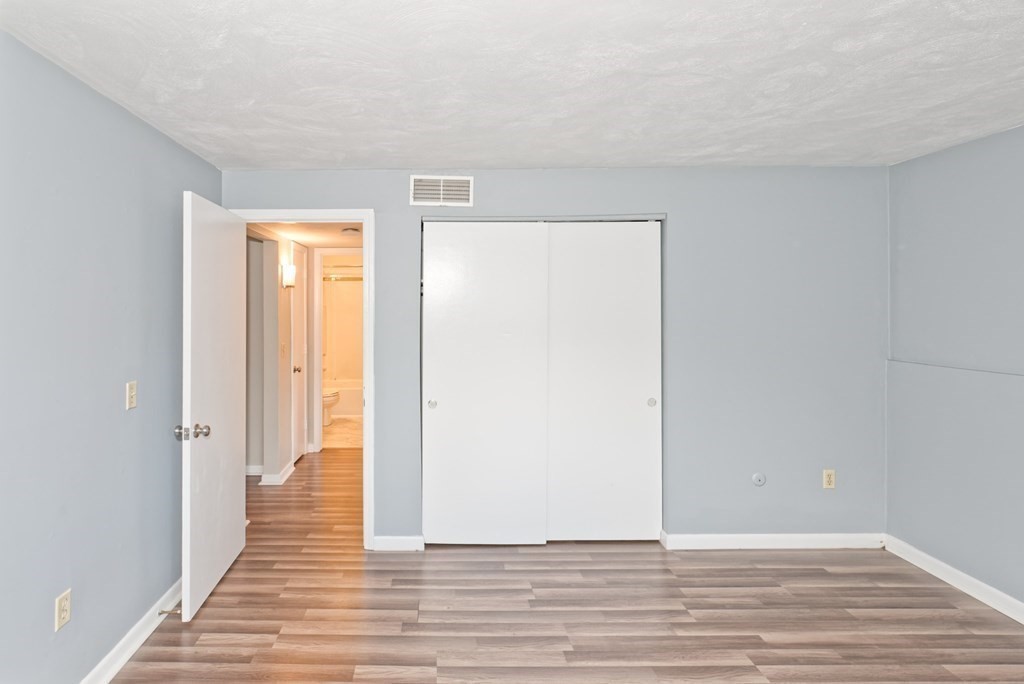176 Maple Avenue, Unit 27 Rutland, MA 01543 - Photo 8 of 19 a view of a room with wooden floor
