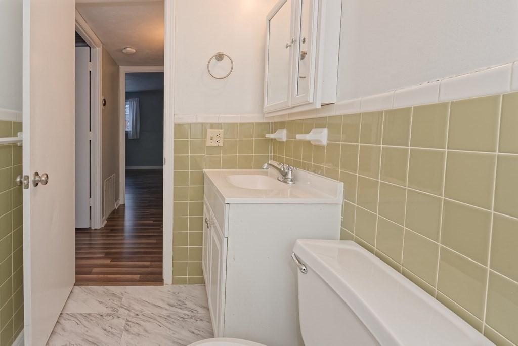 176 Maple Avenue, Unit 27 Rutland, MA 01543 - Photo 10 of 19 a bathroom with a sink a toilet and shower