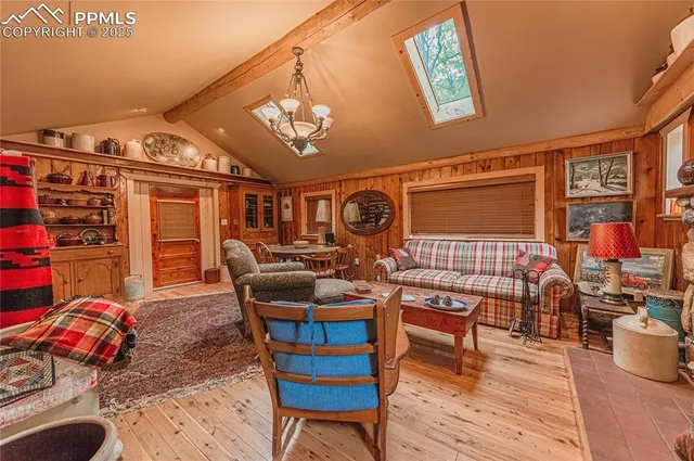 a living room with lots of furniture and a wooden floor