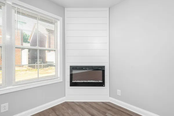 a living room with a fireplace and a floor