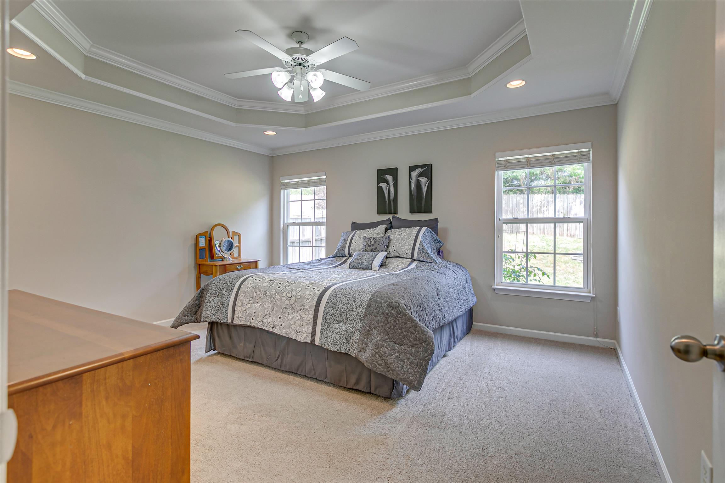 2030 Fiona Way Spring Hill, TN 37174 - Photo 14 of 25 The luxurious master suite is expansive. Notice the tray ceiling and windows carefully flanking the bed position.