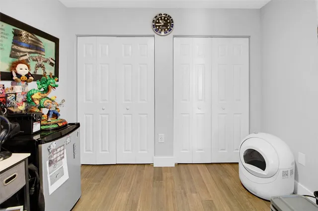 a view of a storage & utility room with wooden floor
