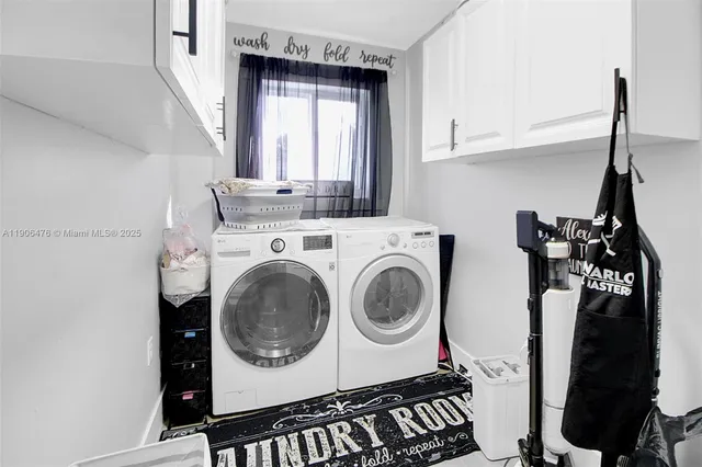 a utility room with sink dryer and washer