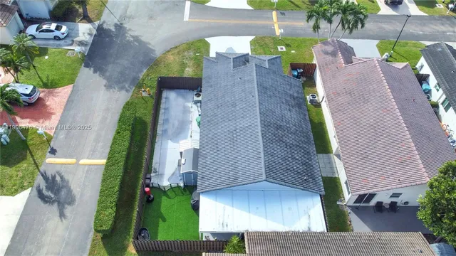 an aerial view of a house with a garden