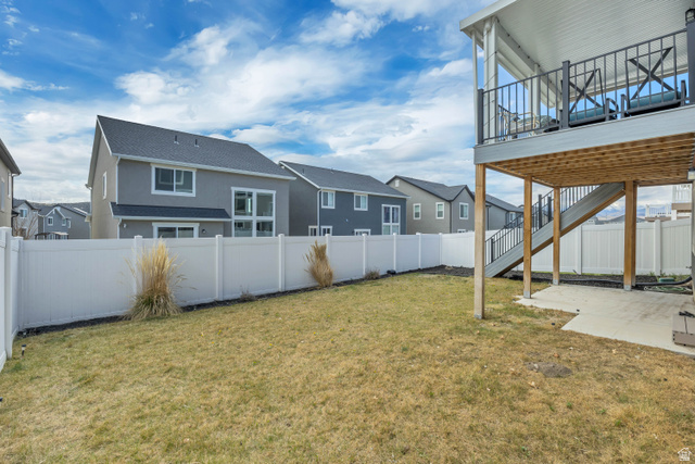 1577 Quailhill Road Saratoga Springs, UT 84045 - Photo 38 of 46 Fenced backyard featuring a patio, a residential view, and a balcony