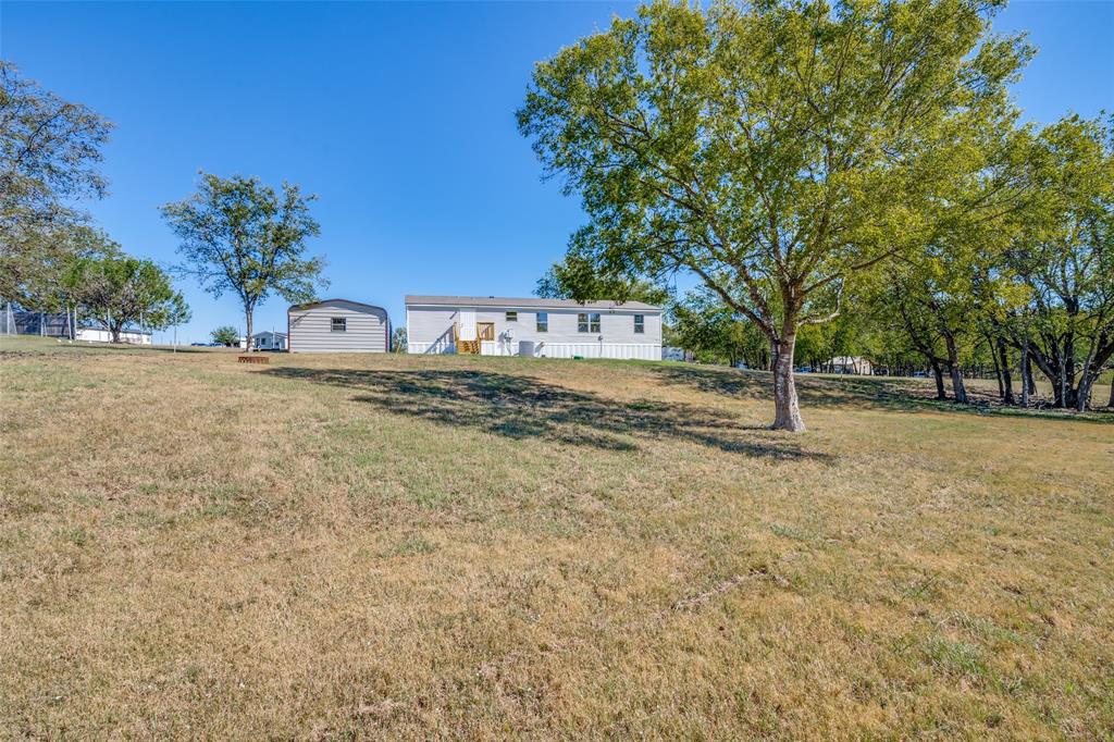 3176 North Ridge Crandall, TX 75114 - Photo 23 of 24 a backyard of a house with lots of green space