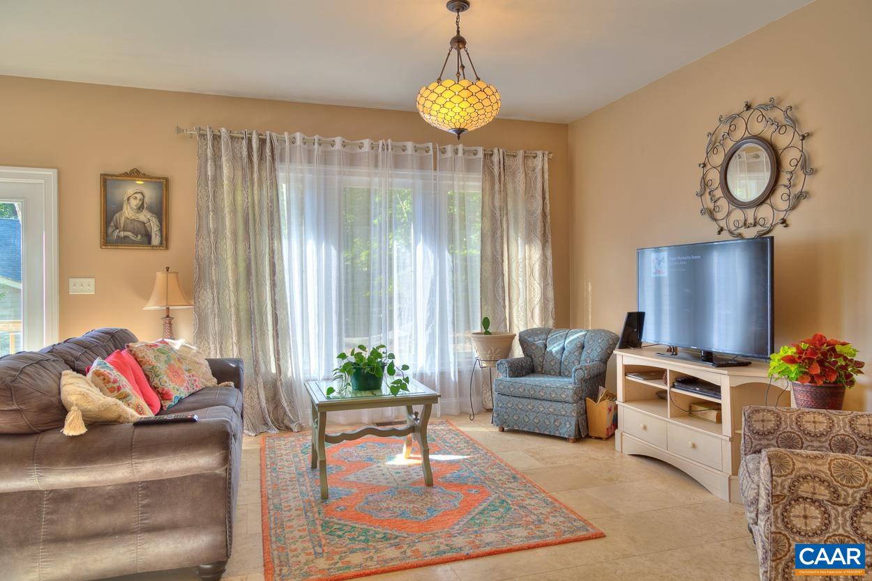 16 Ashton Road Palmyra, VA 22963 - Photo 8 of 64 a living room with furniture and a flat screen tv