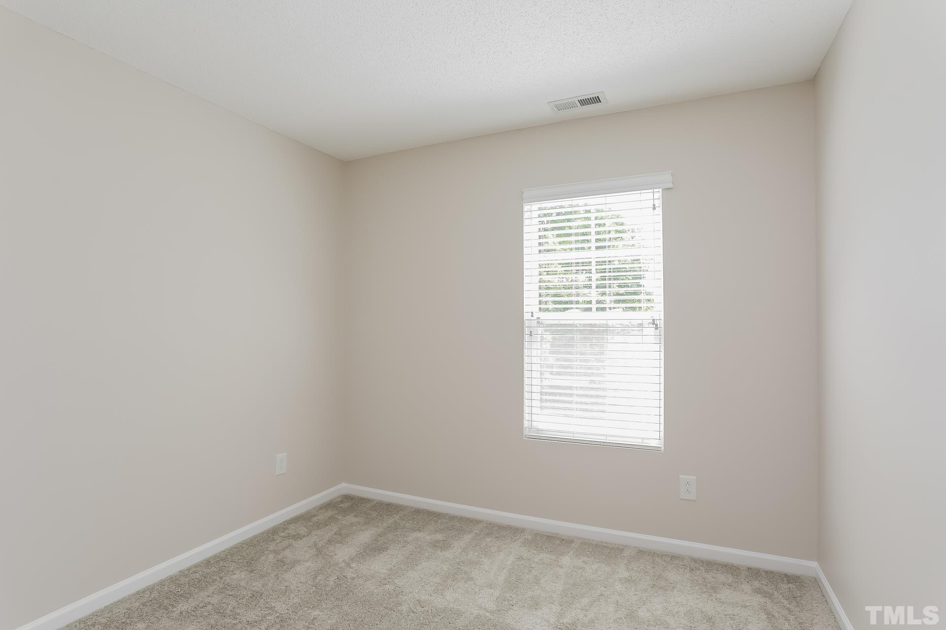 3618 Mountain Brook Circle Durham, NC 27704 - Photo 13 of 15 an empty room with a window