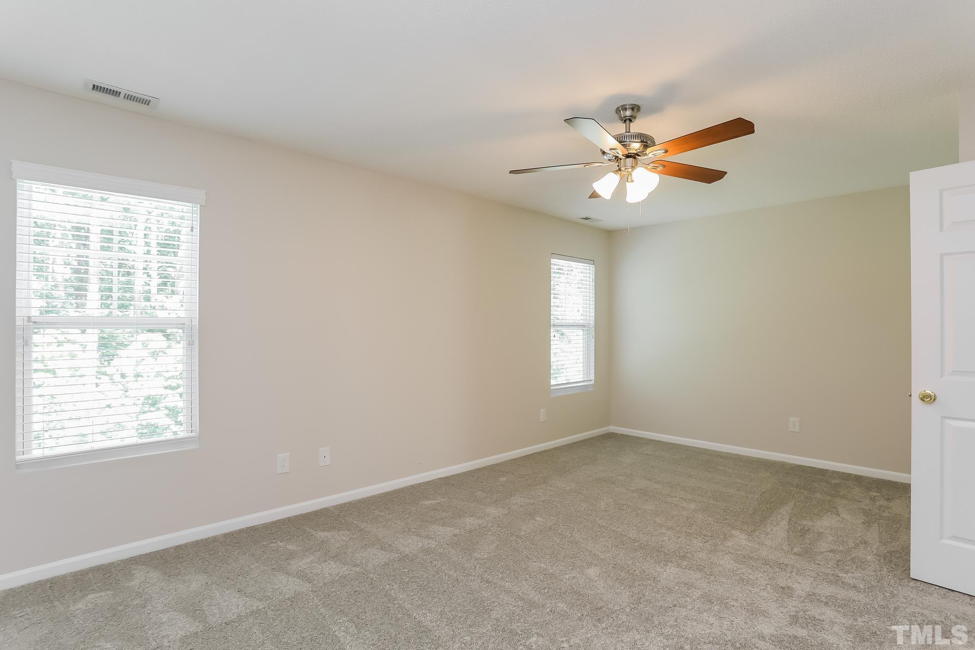 3618 Mountain Brook Circle Durham, NC 27704 - Photo 10 of 15 a view of a room with a ceiling fan and a window
