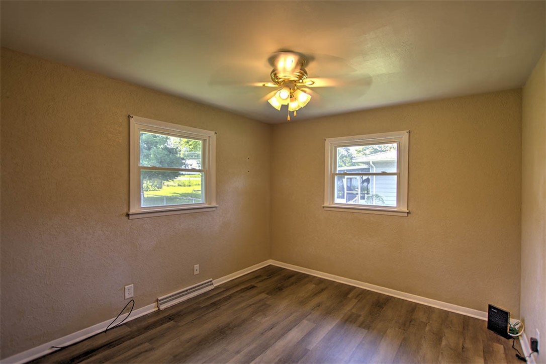 3454 North Christine Drive Decatur, IL 62526 - Photo 8 of 23 a view of an empty room with a window and wooden floor