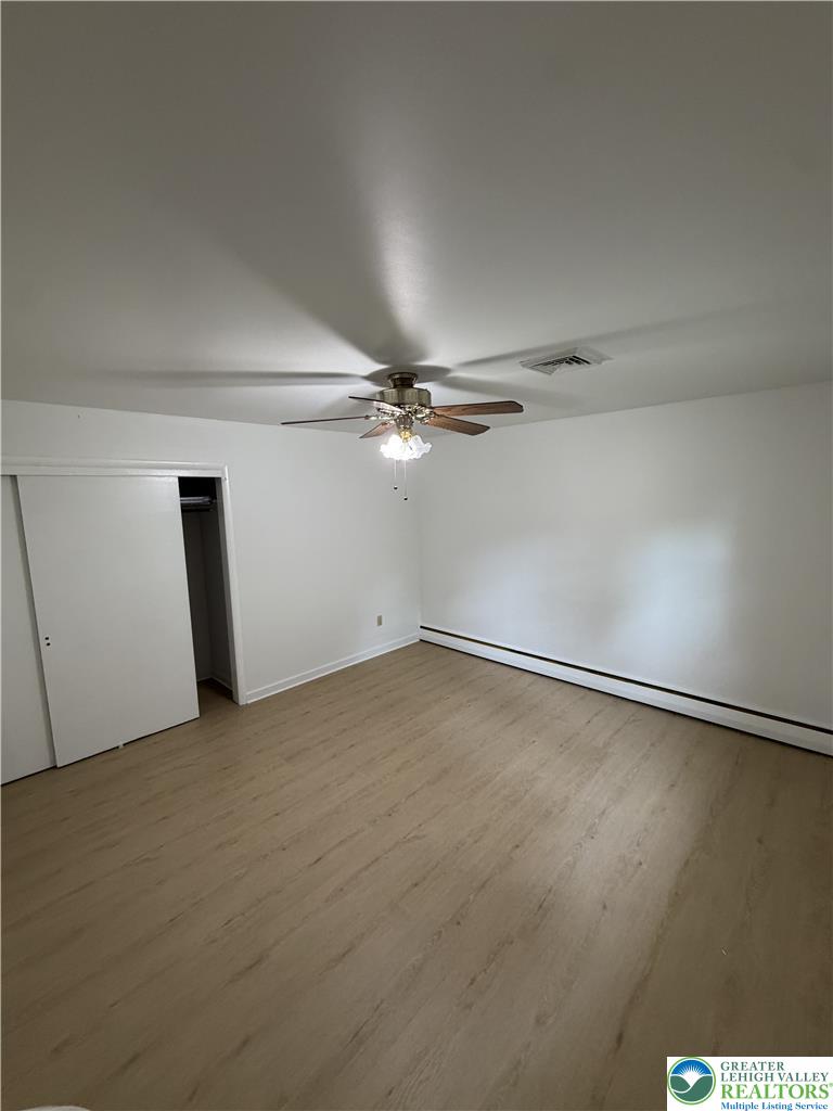 5391 Chapmans Road, Unit 2 Orefield, PA 18069 - Photo 21 of 22 A well-lit bedroom with modern wood flooring awaits your personal touch.