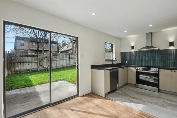 a kitchen with kitchen island counter top space and appliances