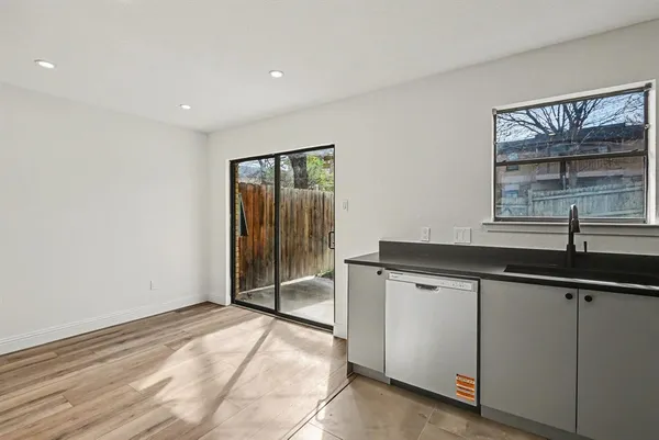 a view of a sink and a window in a room