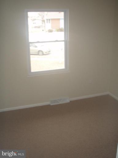 7108 Reno Road Windsor Mill, MD 21244 - Photo 11 of 29 an empty room with a window