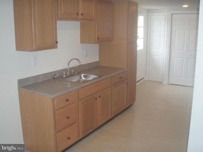 7108 Reno Road Windsor Mill, MD 21244 - Photo 12 of 29 a utility room with cabinets washer and dryer