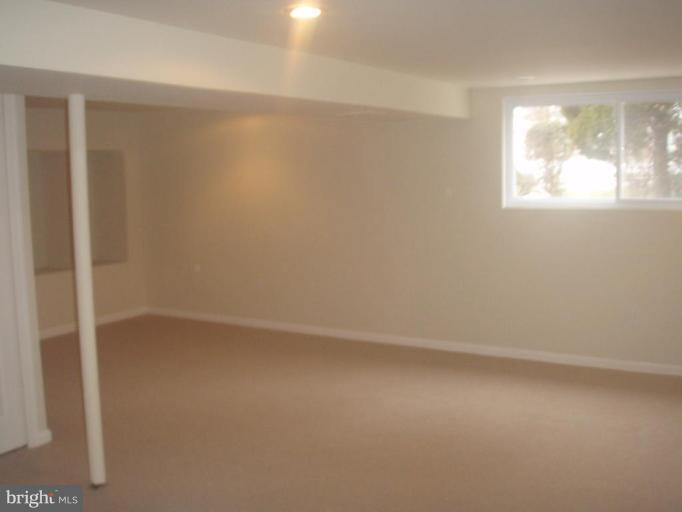 7108 Reno Road Windsor Mill, MD 21244 - Photo 13 of 29 an empty room with windows