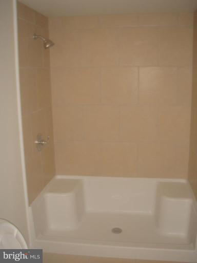 7108 Reno Road Windsor Mill, MD 21244 - Photo 17 of 29 a bathroom with a bathtub