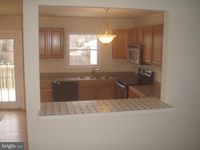 7108 Reno Road Windsor Mill, MD 21244 - Photo 4 of 29 a view of a kitchen from a window