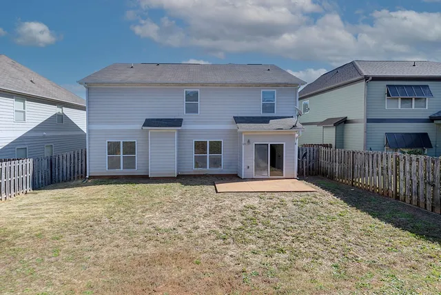 a house with wooden fence